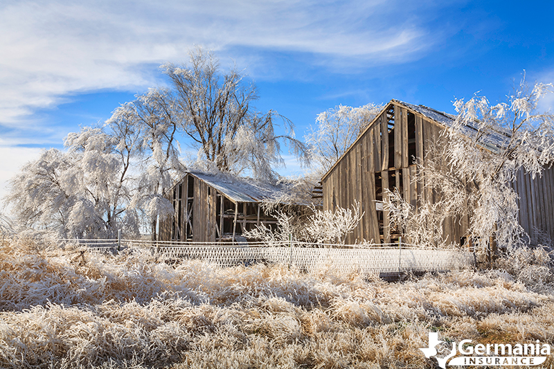 Snow and ice covered barn during a polar vortex in Texas