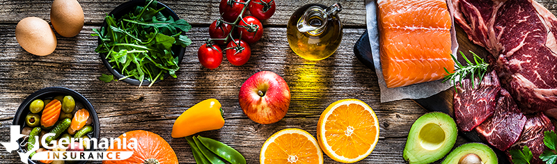 An assortment of healthy foods laid out on a wooden table