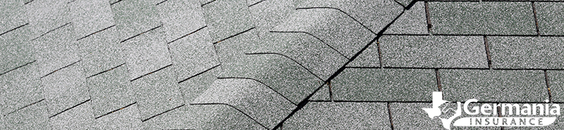 Asphalt shingled roof, demonstrating the different types of roof shingles. 