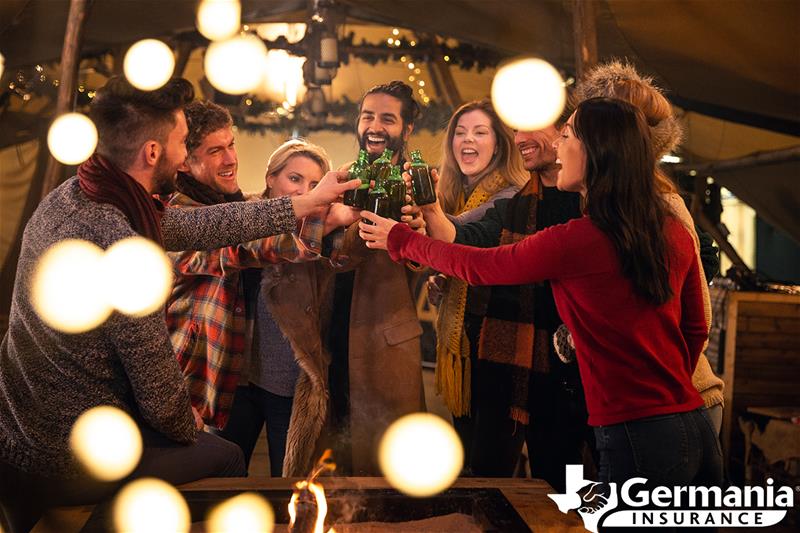 Several friends celebrating together, toasting at a holiday party.
