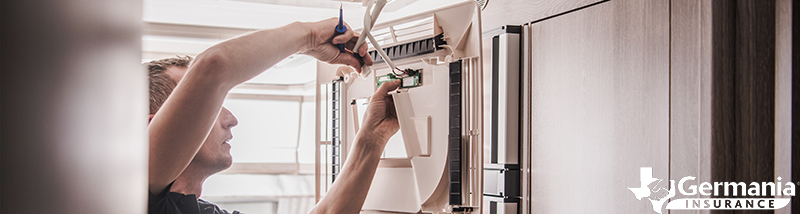 A man fixing the AC unit on an RV