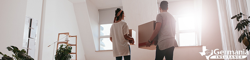 A couple moving into their new new rental home after learning how renters insurance works.