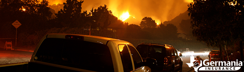 A series of cars evacuating from a wildfire