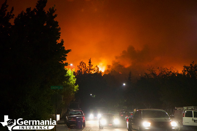 A series of cars evacuating from a wildfire