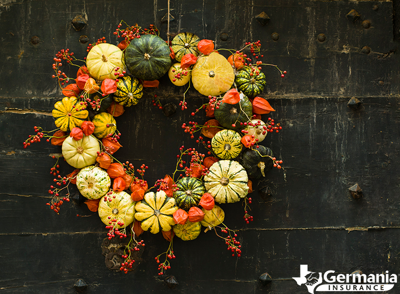 A DIY fall wreath with pumpkins and other fall decorations