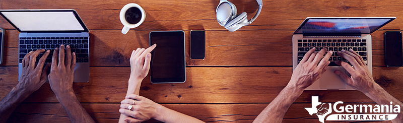 Several people at a coffee shop staying safe on public Wi-Fi