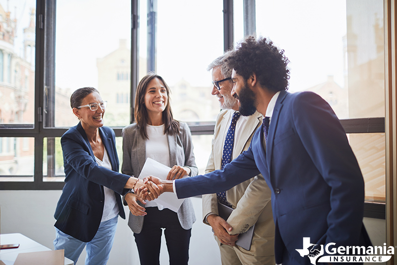 Insurance-Career-Month A man shaking hands as he begins his new career in the insurance industry.