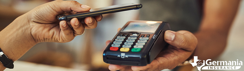 A smart phone being used to make a mobile payment using a digital wallet