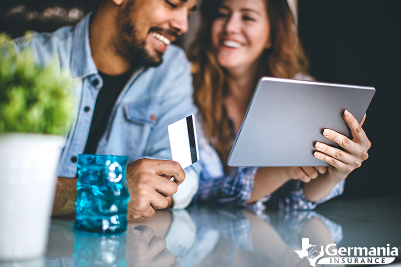 A couple shopping online with a credit card