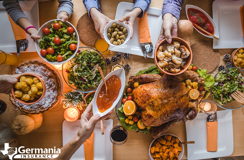 A Thanksgiving table with turkey and other Thanksgiving menu items