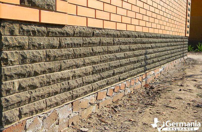 A brick and concrete foundation settling