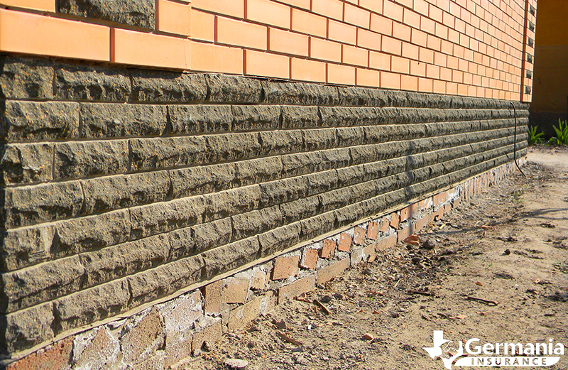 A brick and concrete foundation settling