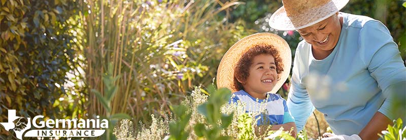 A grandmother in the garden with her granddaughter