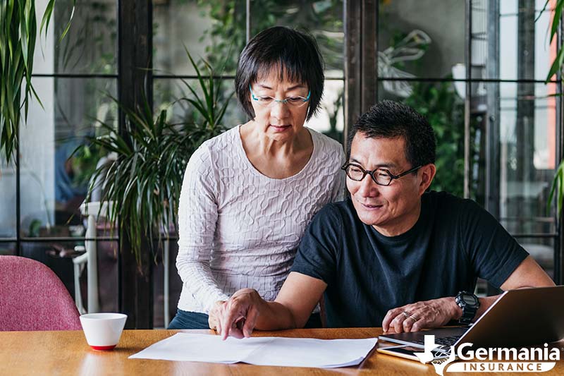 A couple looking at life insurance options as they plan for retirement